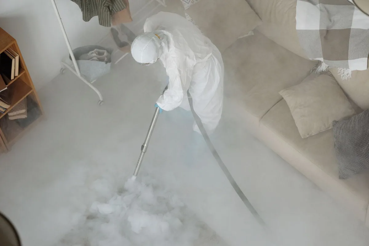 Biohazard cleanup technician in protective equipment, Sherwood Estates, Kansas City, MO